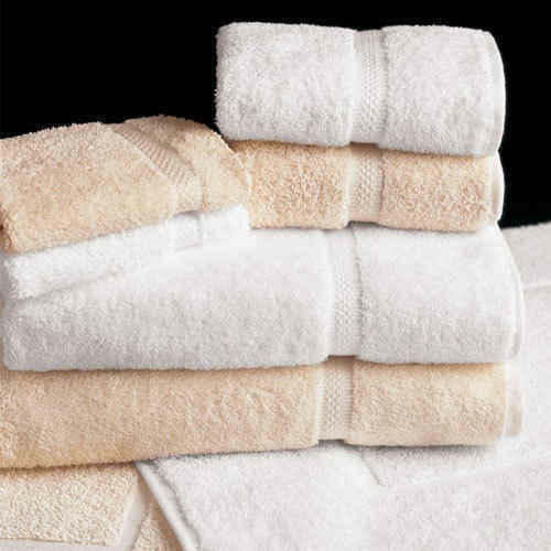 Valiant Products Sovereign dobby border hand towels in white and ecru cotton blend, stacked for hospitality use.