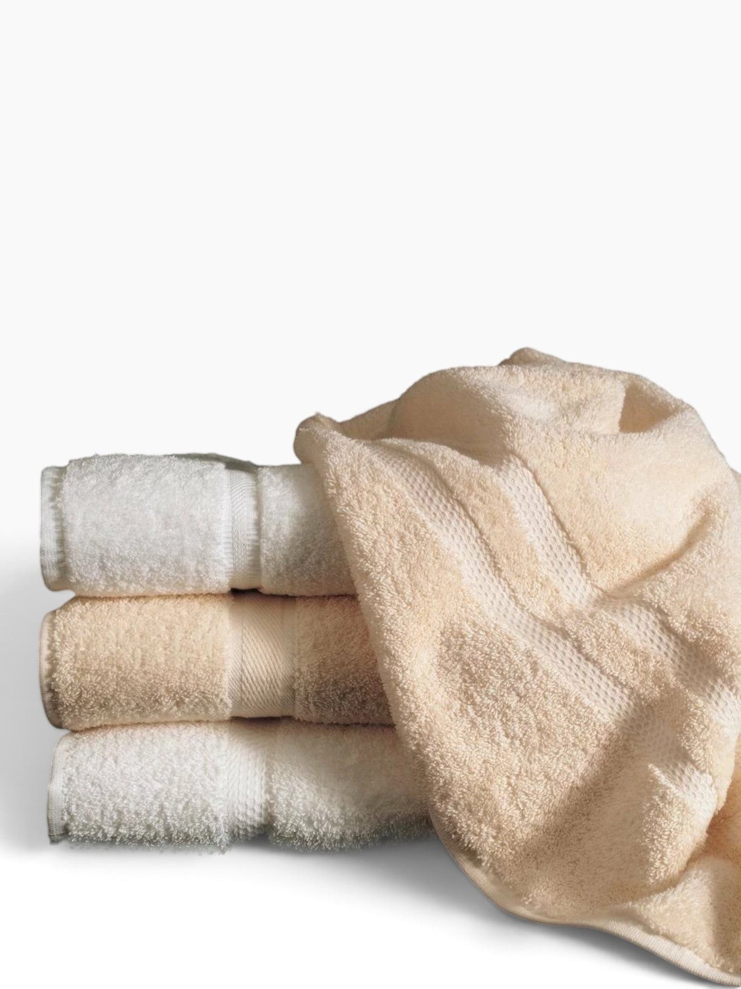 Valiant Products Sovereign dobby border hand towels in white and ecru cotton blend stacked for hospitality use.