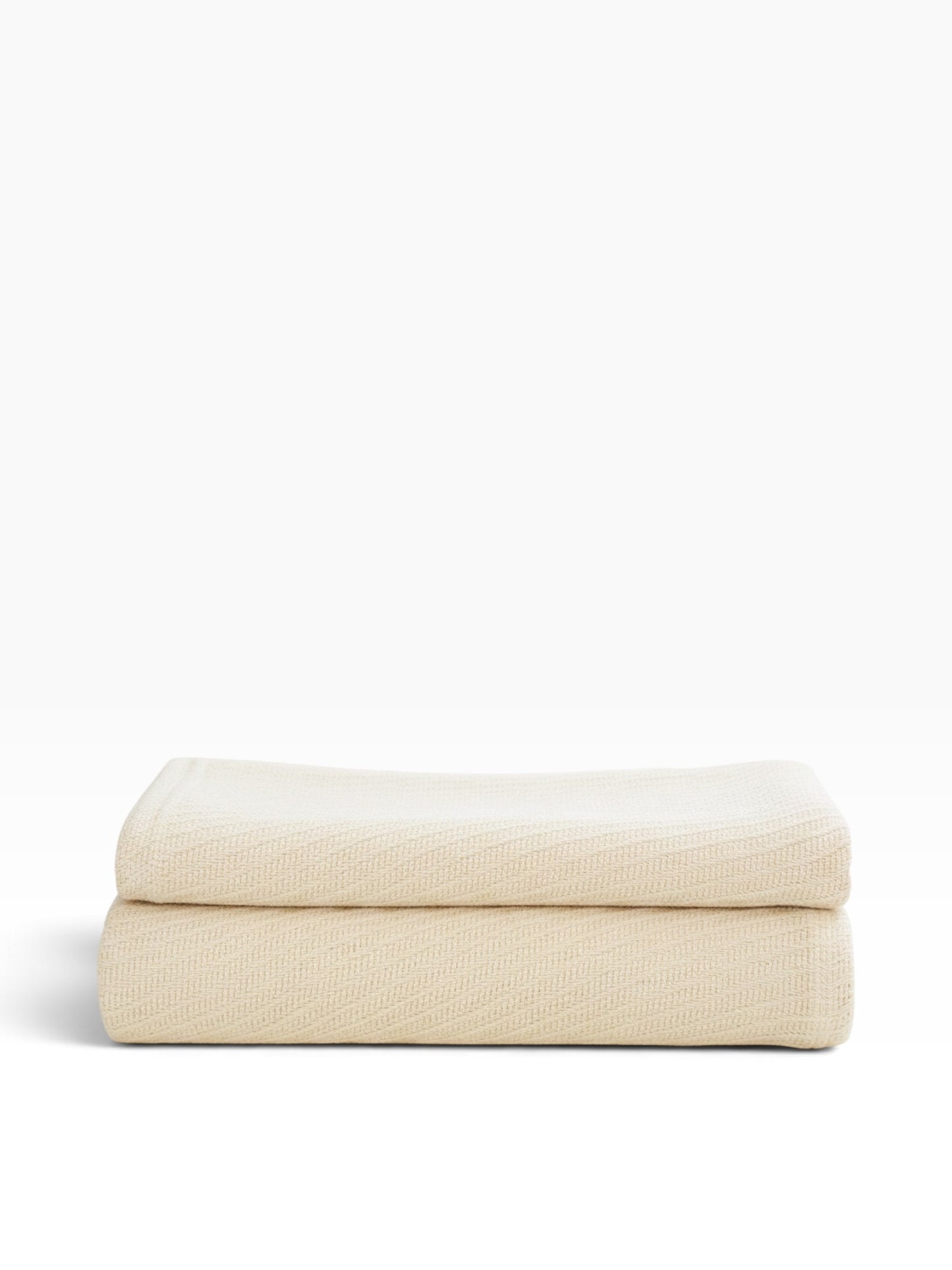 Valiant Products Sovereign 100% cotton blanket in natural beige with a tight diagonal weave for hospitality use