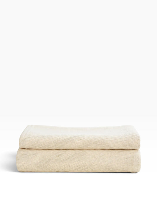 Valiant Products Sovereign 100% cotton blanket in natural beige with a tight diagonal weave for hospitality use