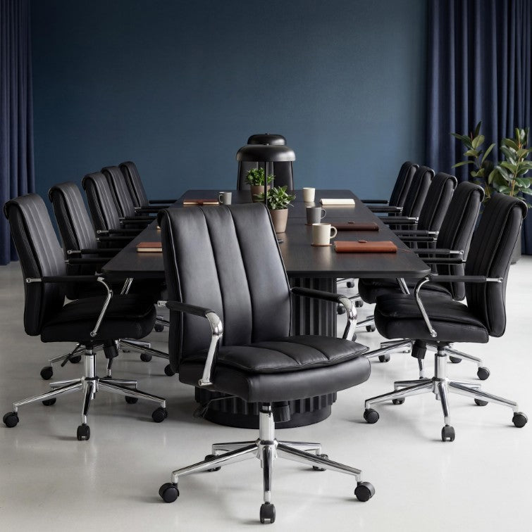 Valiant Products Stanton pillow top ergonomic office chairs with black vinyl upholstery and chrome base in boardroom