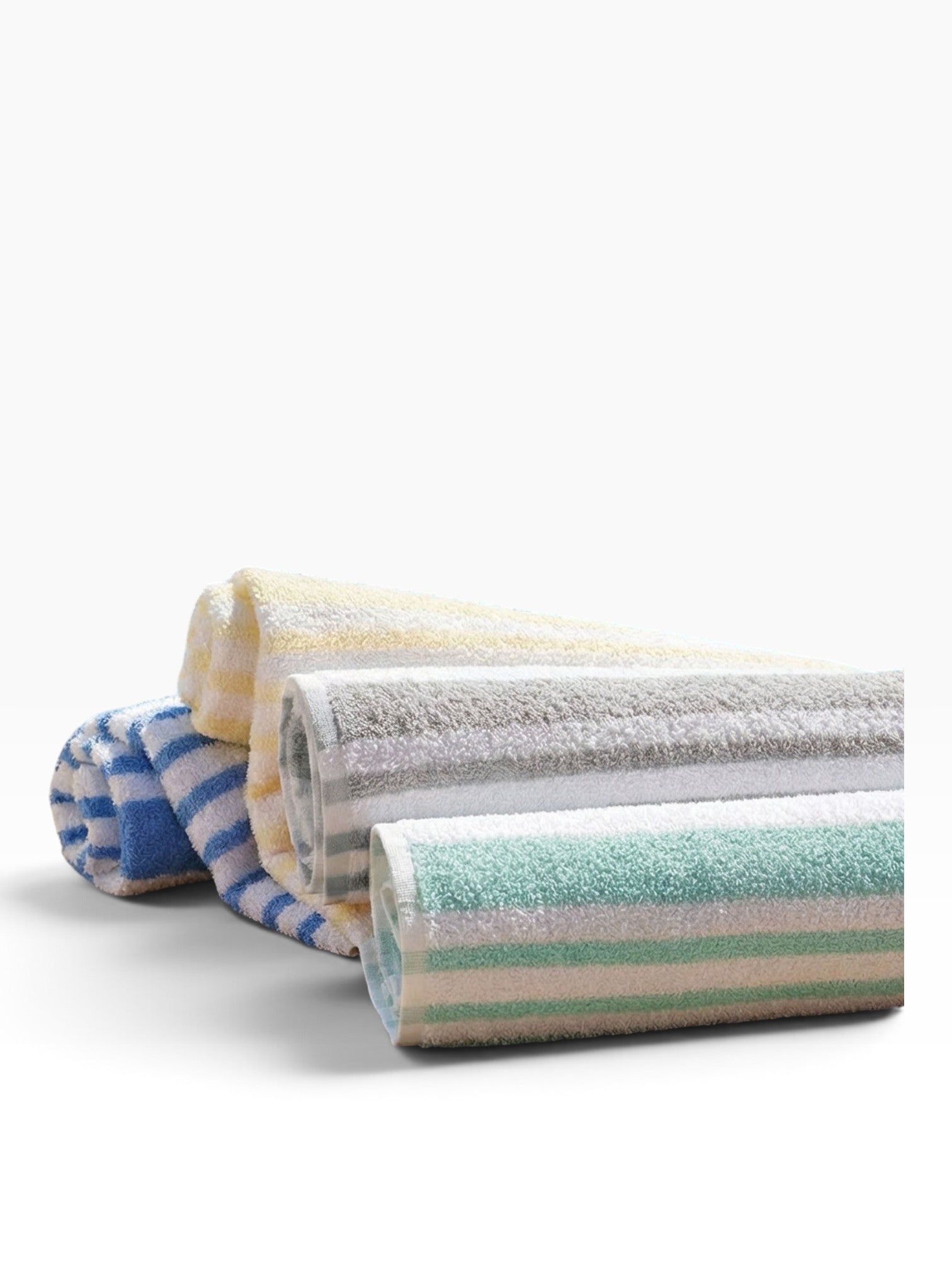 Valiant Products Tropical Stripe borderless cotton pool towels in pastel blue, yellow, grey, and jade green stripes.