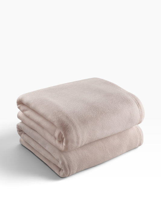 Valiant Products tan microfiber fleece blanket folded neatly, featuring a soft low-pile texture and durable stitching.