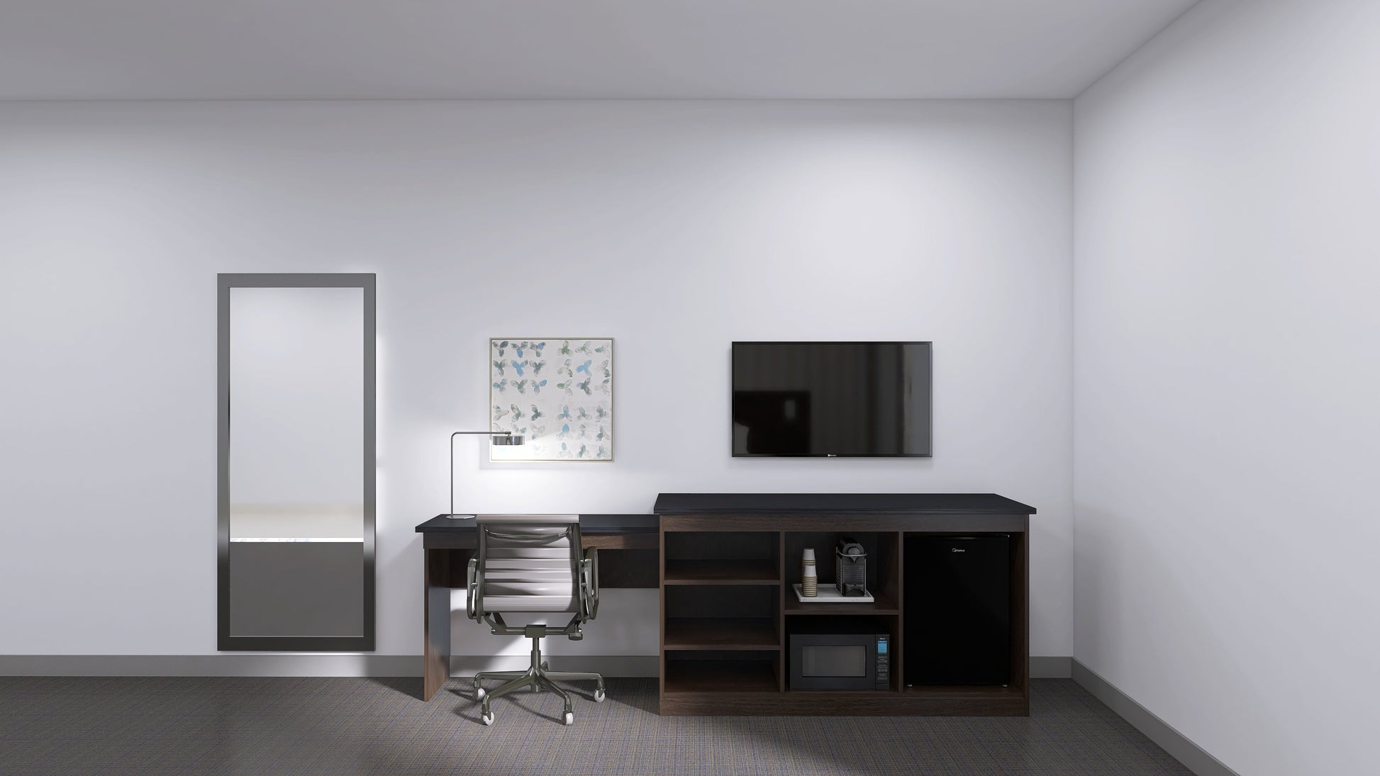 Valiant Products Telluride Unit featuring a desk, open shelving for appliances, and a black top in a hotel room.