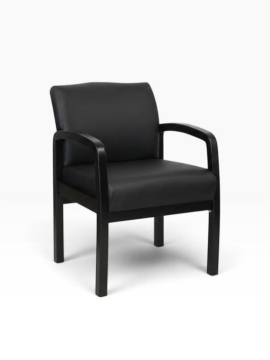 Valiant Products Tiernan guest chair with black antimicrobial vinyl upholstery and a sleek black wood frame.