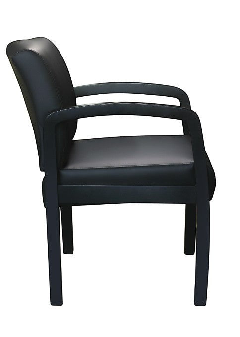 Valiant Products Tiernan guest chair in black antimicrobial vinyl with a sleek black wood frame, side view.