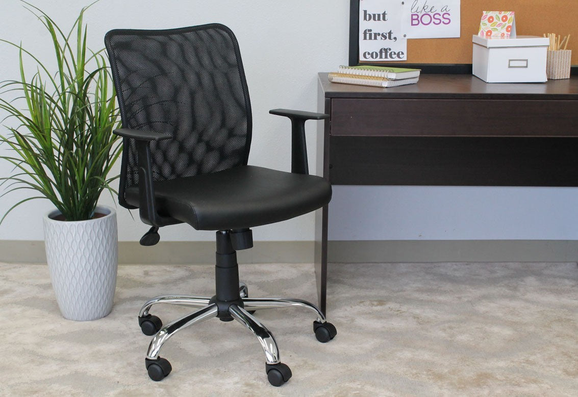 Valiant Products Tilden ergonomic office chair with black mesh back, vinyl seat, and chrome base in a home office.