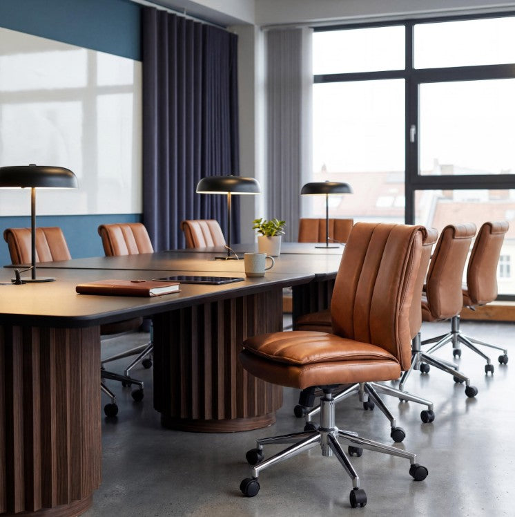 Valiant Products Torin armless ergonomic office chair with tan vinyl pillow-top cushioning and a chrome base.