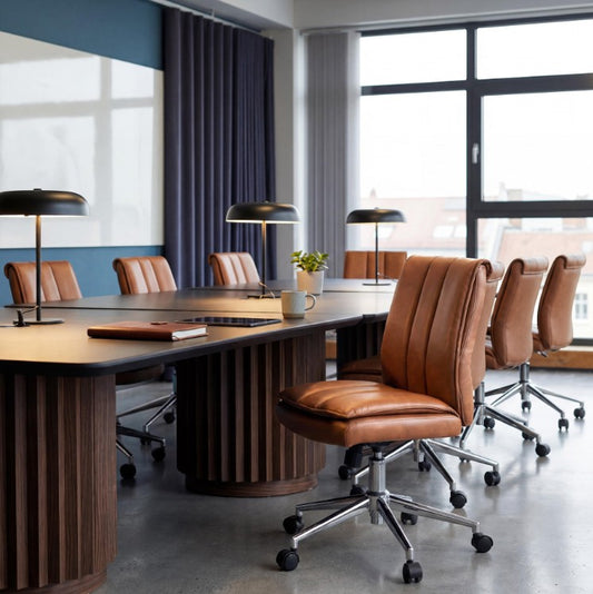 Valiant Products Torin armless ergonomic office chair with tan vinyl pillow-top cushioning and a chrome base.