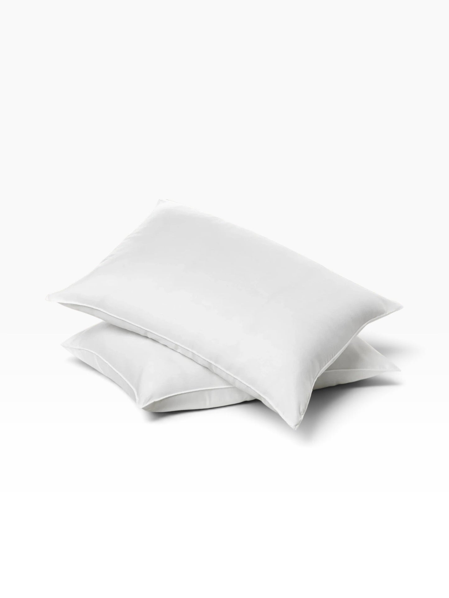 Valiant Products Ultra Touch white microfiber pillows with recycled fiberfill and exposed overlock finish
