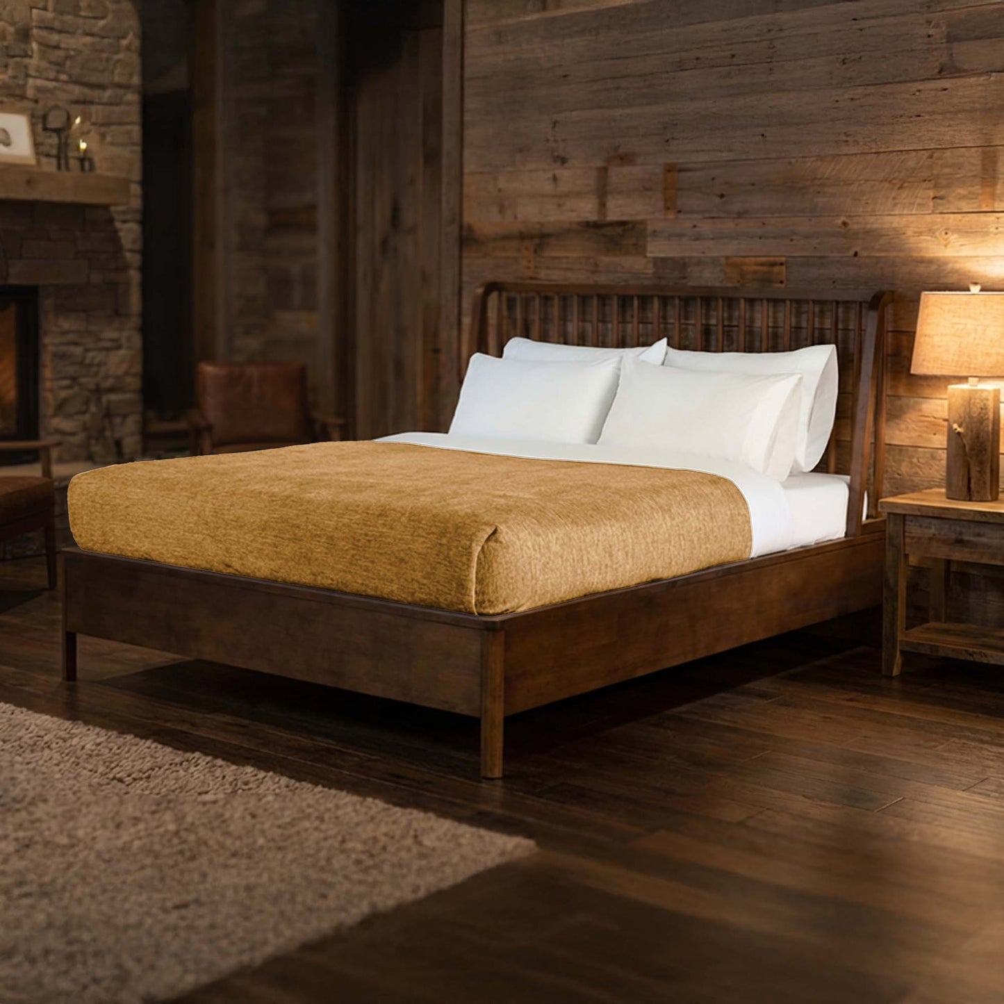Valiant Products Vellux Renew tan polyester chenille blanket draped over a bed in a rustic hotel room setting.