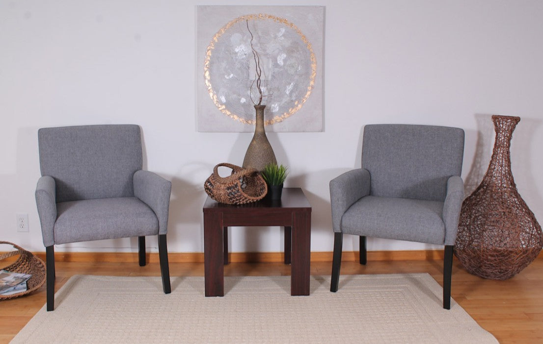 Two Valiant Products Wexler guest accent chairs in medium grey linen with black wood legs in a contemporary setting.