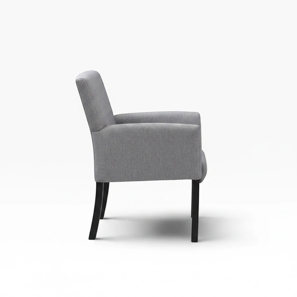 Valiant Products Wexler guest chair in medium grey linen with black wood legs, side view showing box arm styling.