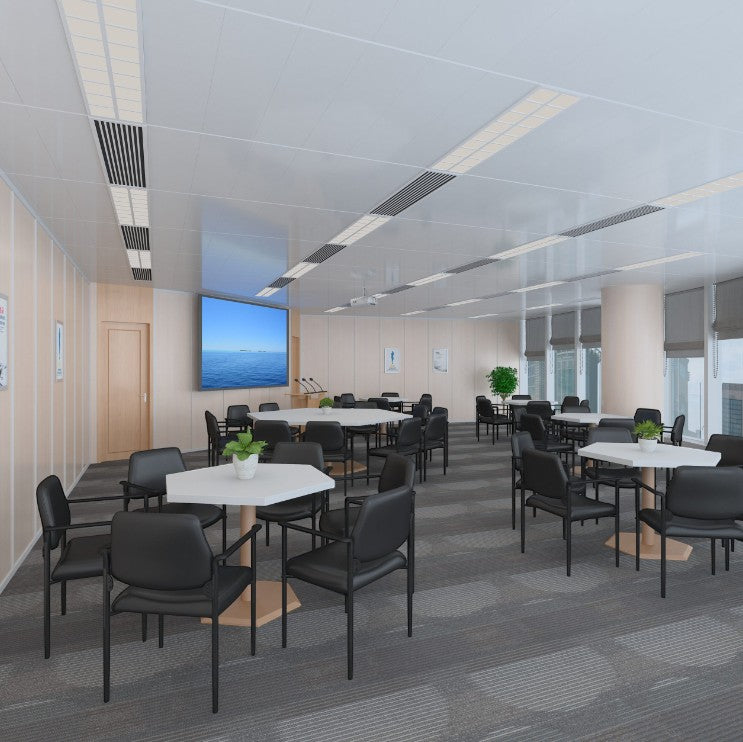 Valiant Products Whitaker black vinyl stacking chairs with arms arranged around tables in a modern office conference room