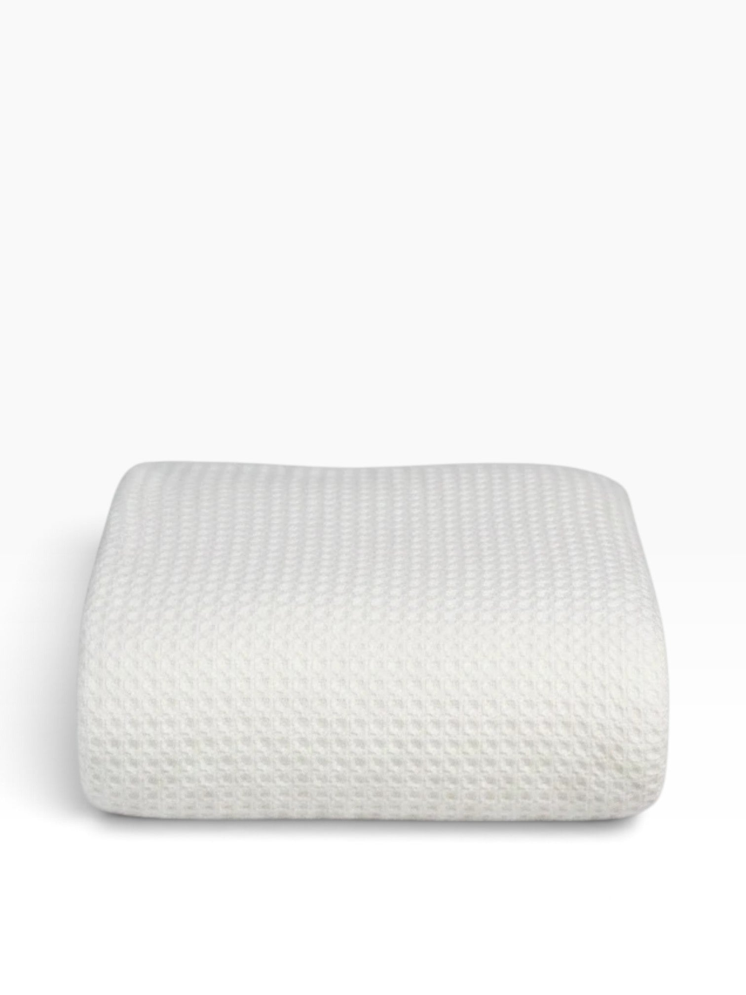 Valiant Products white 100% cotton blanket with a textured basketweave pattern, folded neatly on a white background.