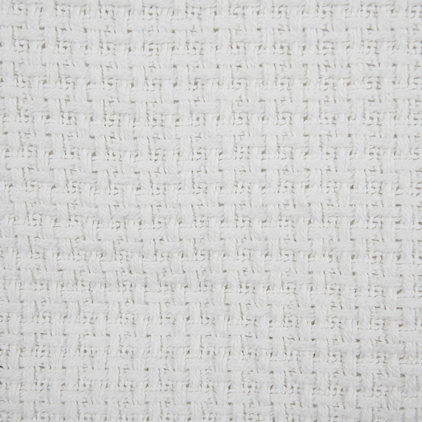 Valiant Products white cotton blanket featuring a detailed basketweave texture and soft ring-spun fabric finish.