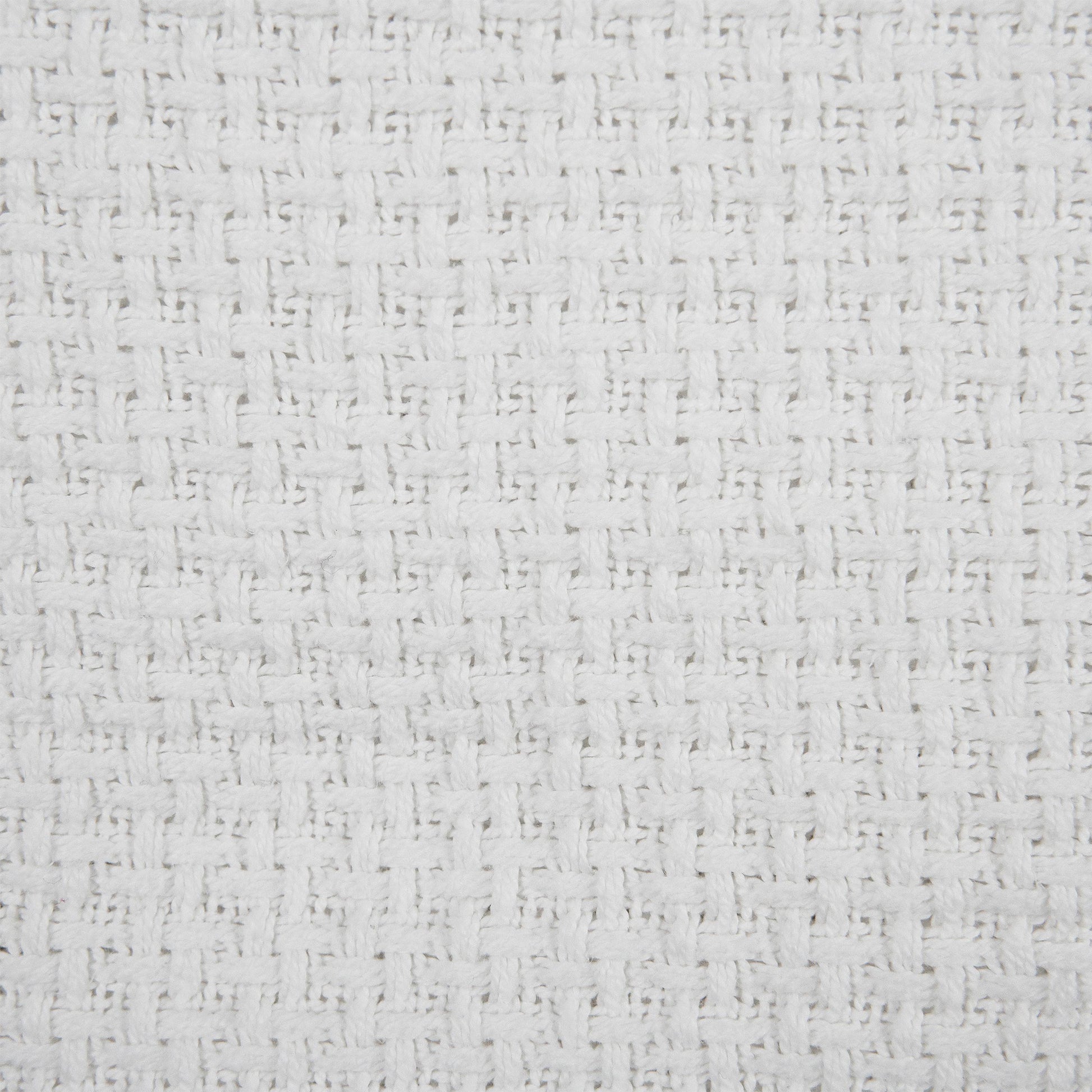 Valiant Products white cotton blanket featuring a detailed basketweave texture and soft ring-spun fabric finish.