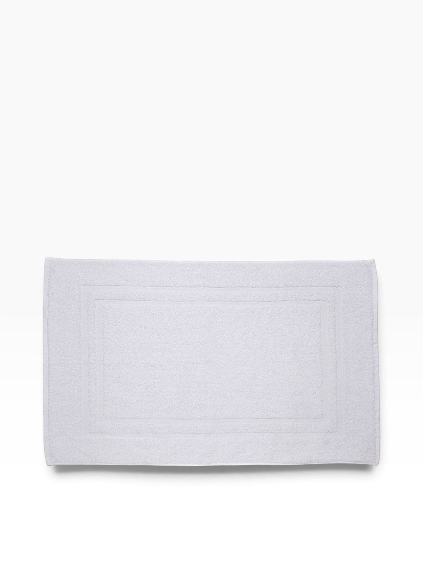 Valiant Products white Sovereign dobby border bath mat with a classic rectangular design for hospitality use.