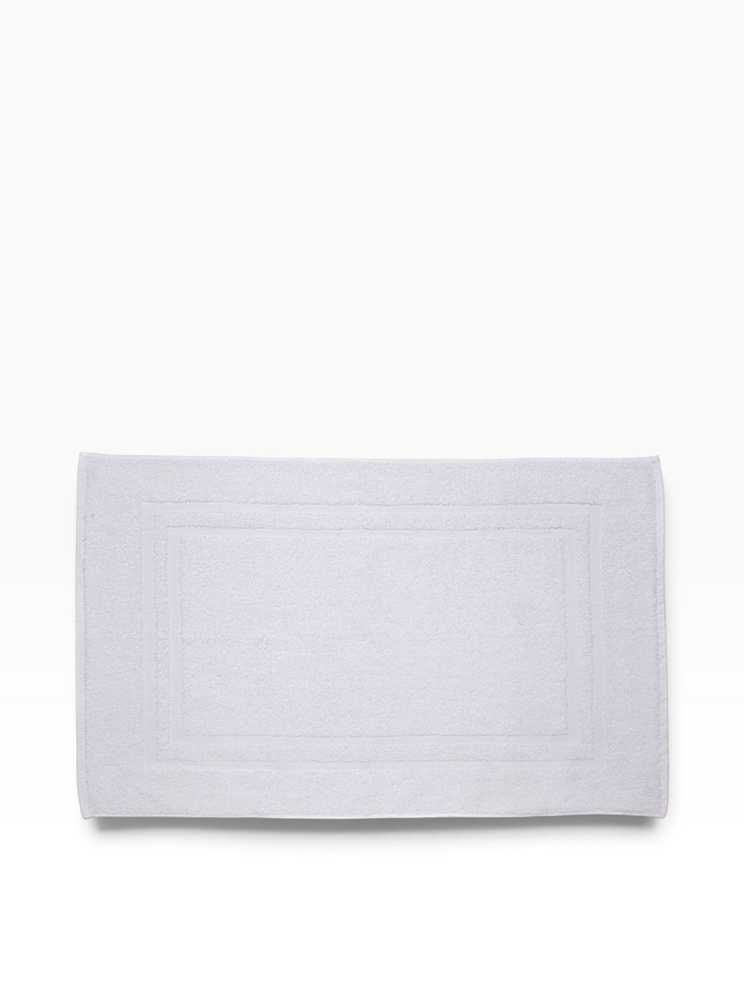 Valiant Products white Sovereign dobby border bath mat with a classic rectangular design for hospitality use.