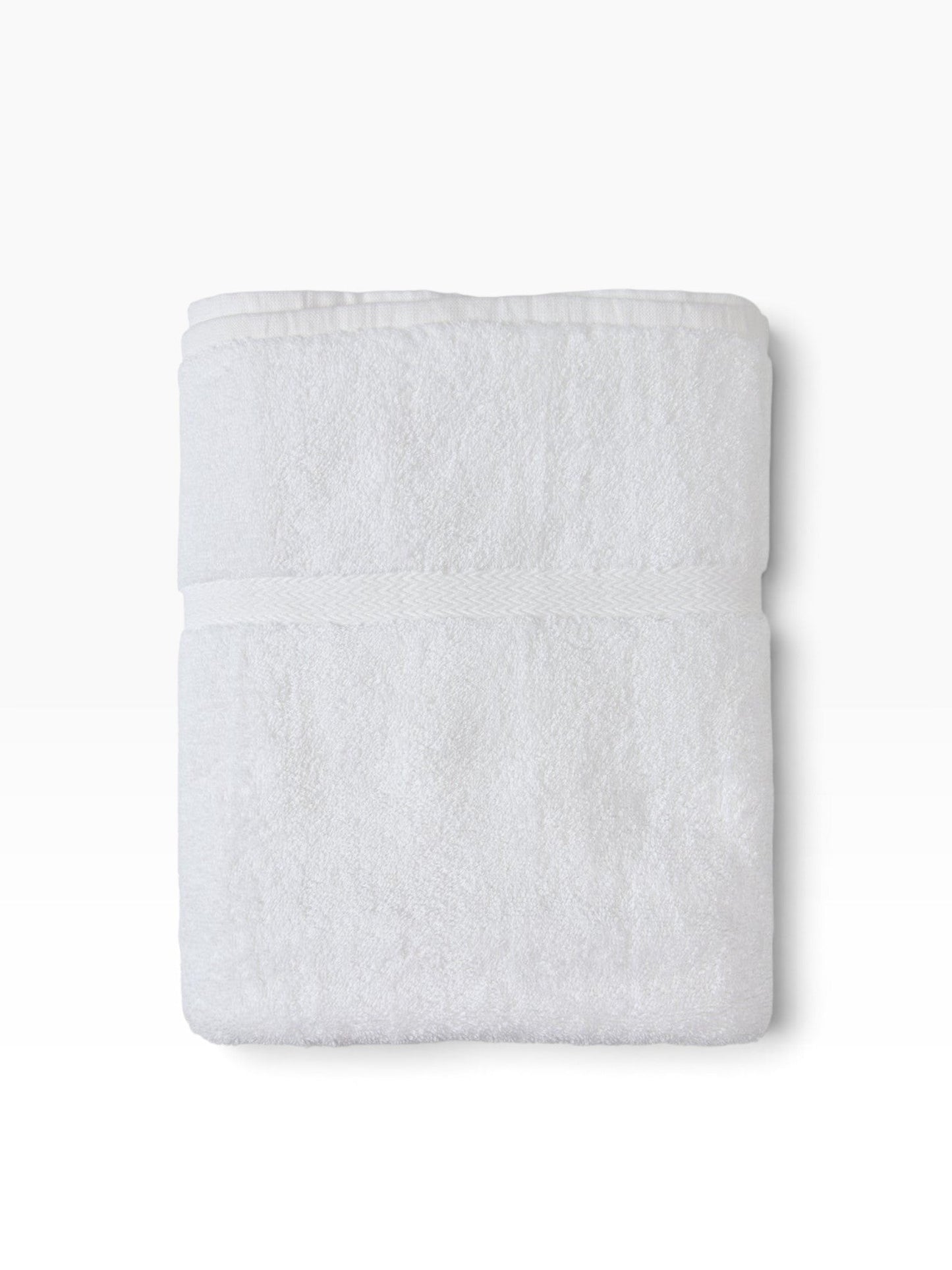 Valiant Products white cotton-blend bath mat with an elegant woven dobby border for hotels and hospitality use.