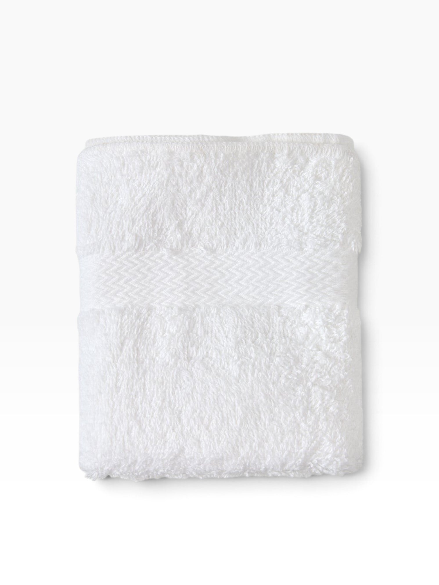 Valiant Products white cotton-blend bath mat featuring an elegant woven dobby border for hotels and resorts