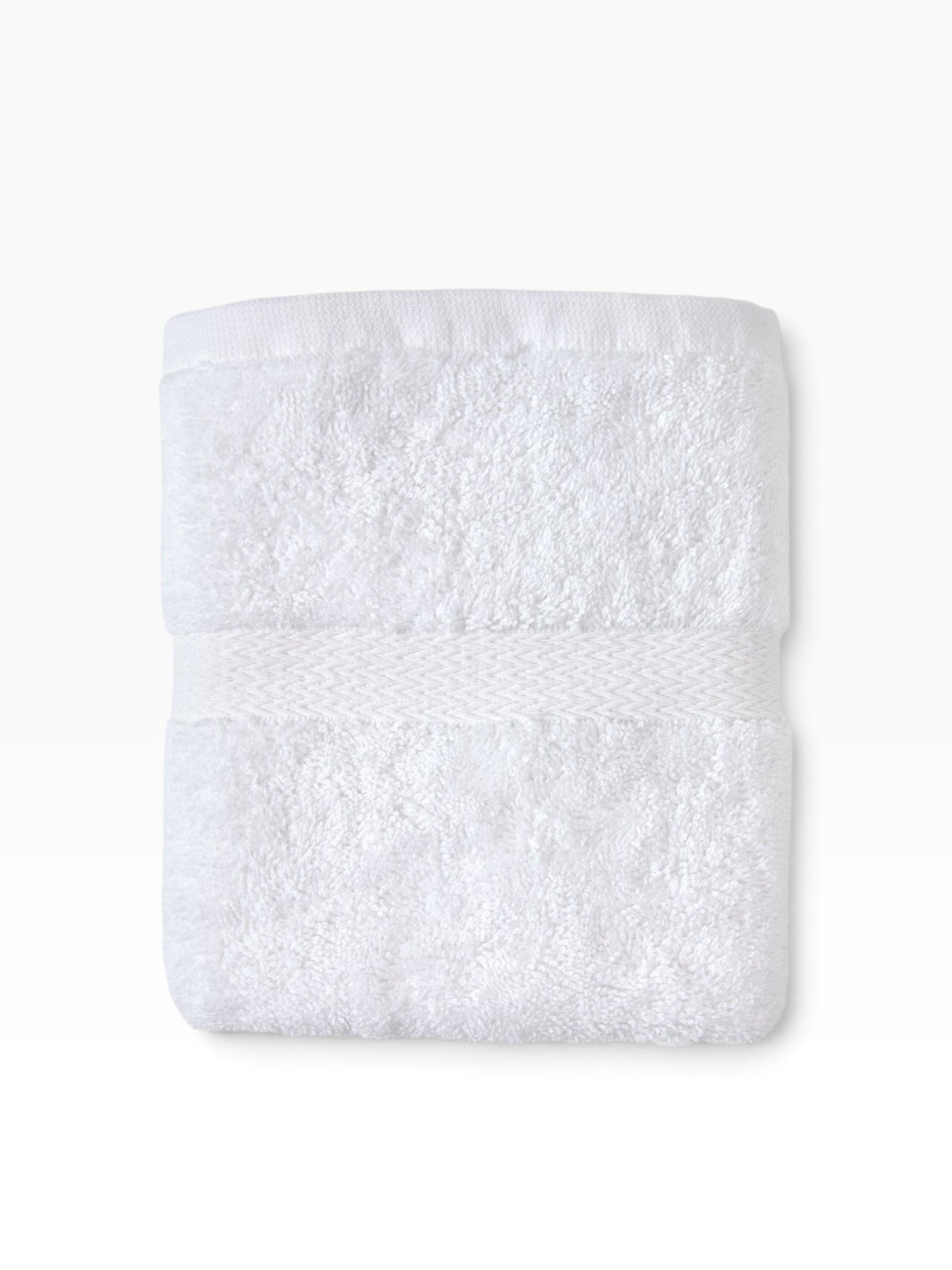 Valiant Products white Royal Suite dobby border bath towel with plush ring-spun cotton loops and hemmed edges.