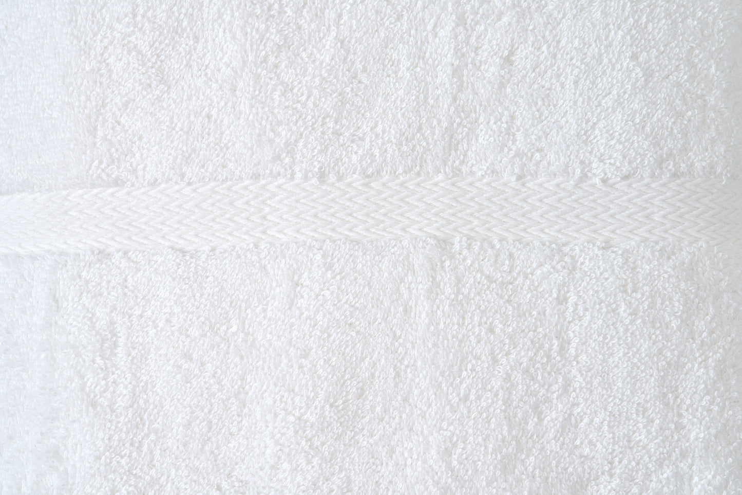 Valiant Products white cotton blend bath towel featuring a detailed woven dobby border and soft ring-spun loops.