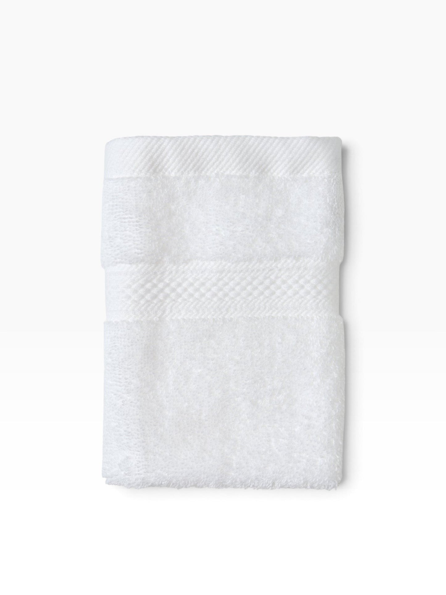 Valiant Products white plush dobby border washcloth with soft cotton loop construction for hospitality use