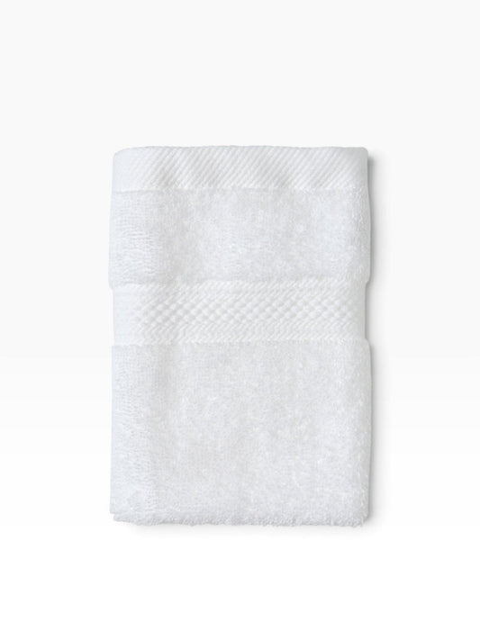 Valiant Products white plush dobby border washcloth with soft cotton loop construction for hospitality use