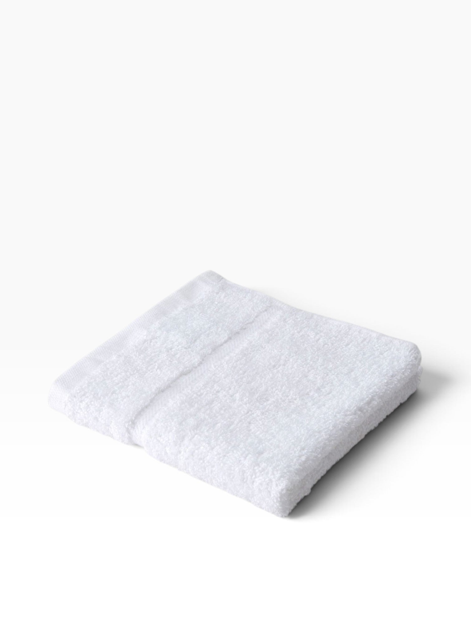 Valiant Products white Sovereign dobby border washcloth with a soft cotton loop texture for hospitality use.