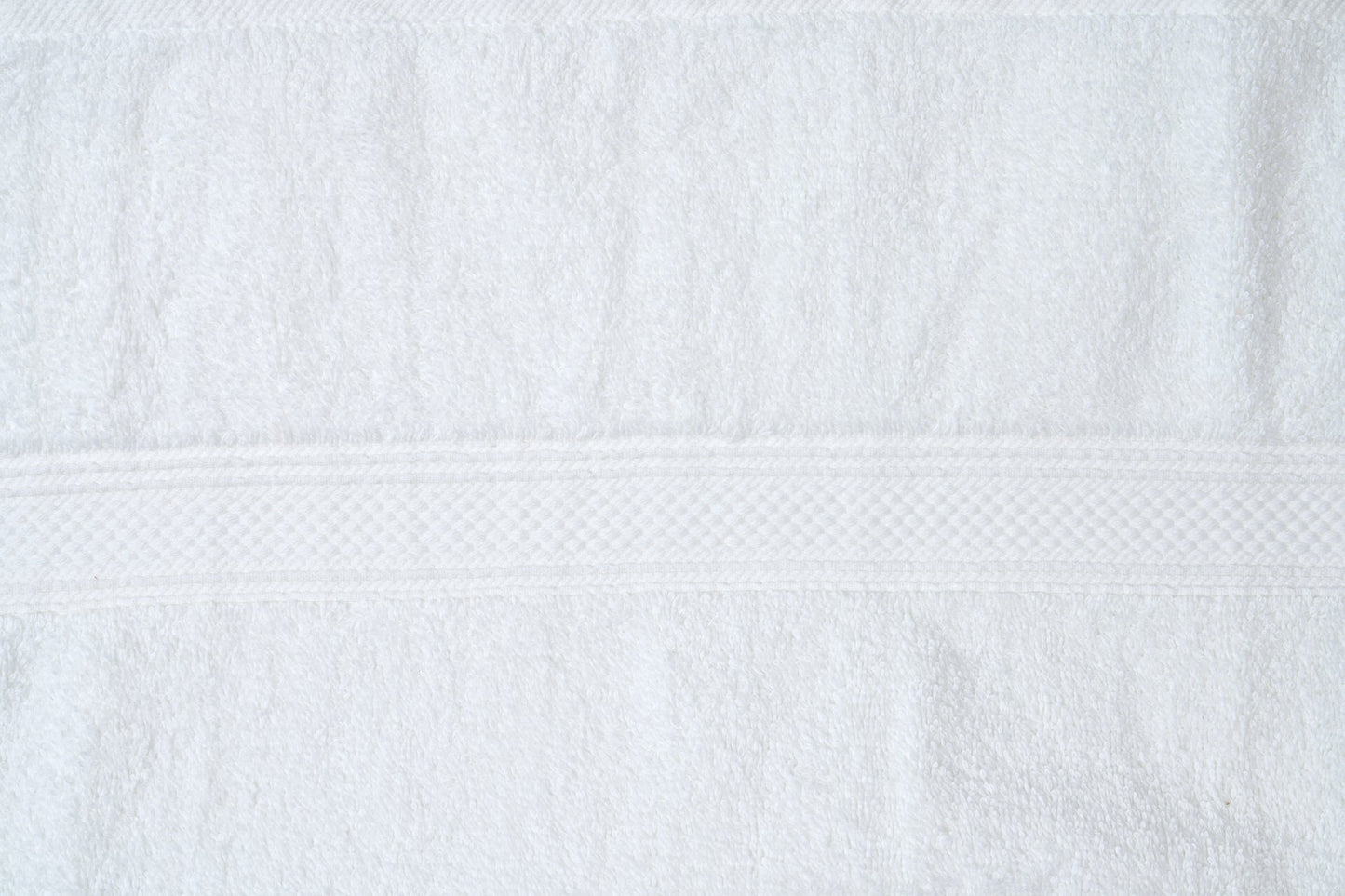 Valiant Products white cotton washcloth with a classic plush dobby border design and soft loop construction