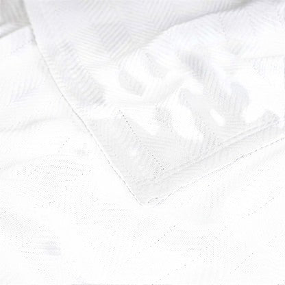 Valiant Products white Atelier Luxe blanket featuring a soft cotton and TENCEL Modal blend with a herringbone weave.