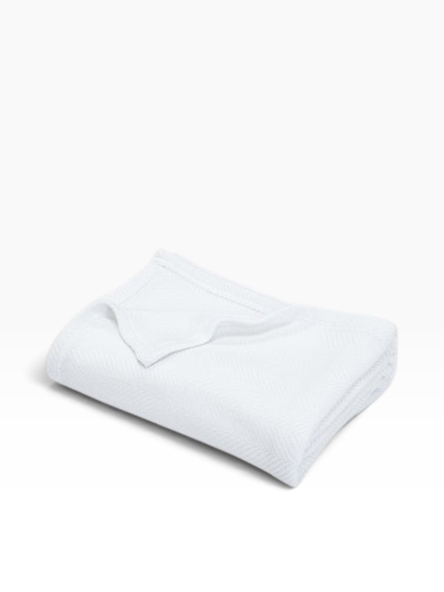 Valiant Products Atelier Luxe white cotton and TENCEL Modal blanket featuring a refined herringbone weave design.