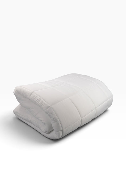 Valiant Products white microfiber down alternative comforter with 8-inch quilted box stitch design for hospitality use.