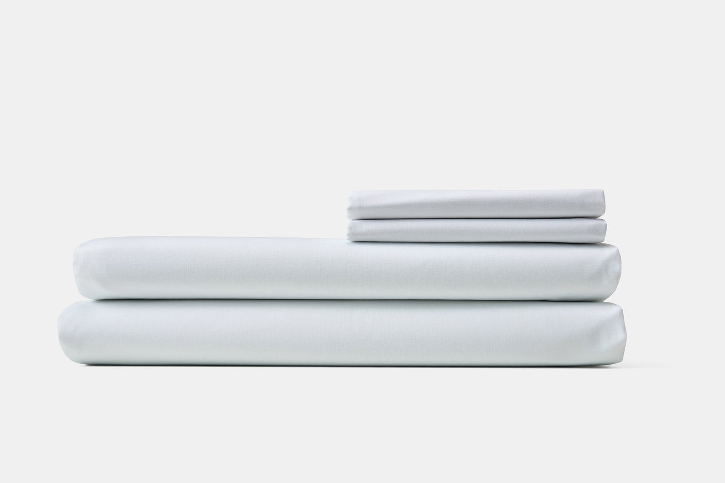 Valiant Products bright white 200 thread count cotton-polyester blend pillowcases stacked neatly on a white background