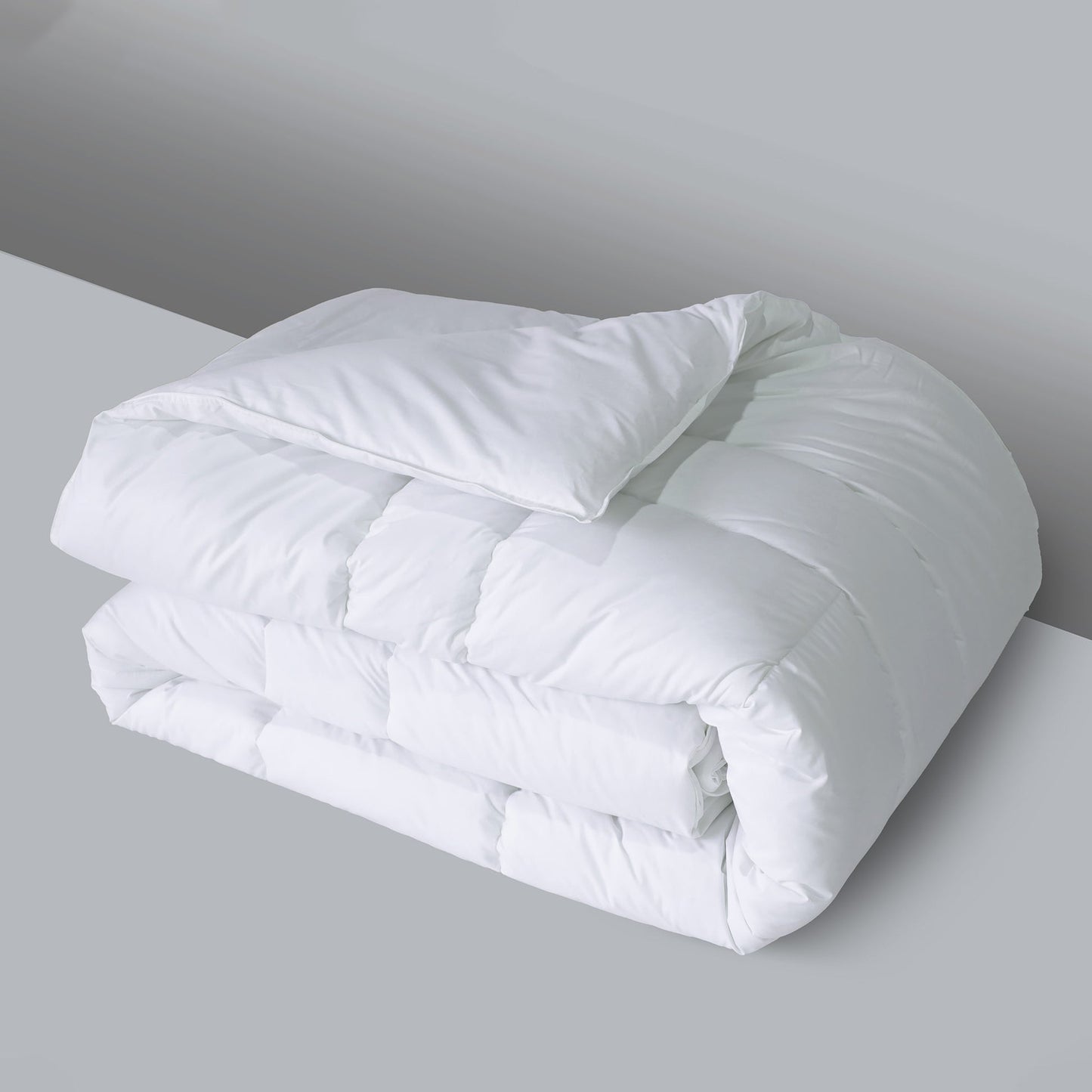 Valiant Products white down alternative quilted comforter with box stitching and a soft cotton shell for hotel luxury.