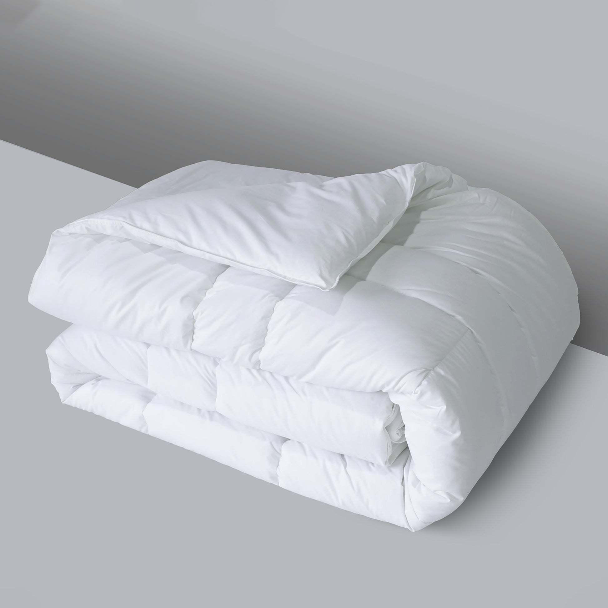 Valiant Products white down alternative quilted comforter with box stitching and a soft cotton shell for hotel luxury.