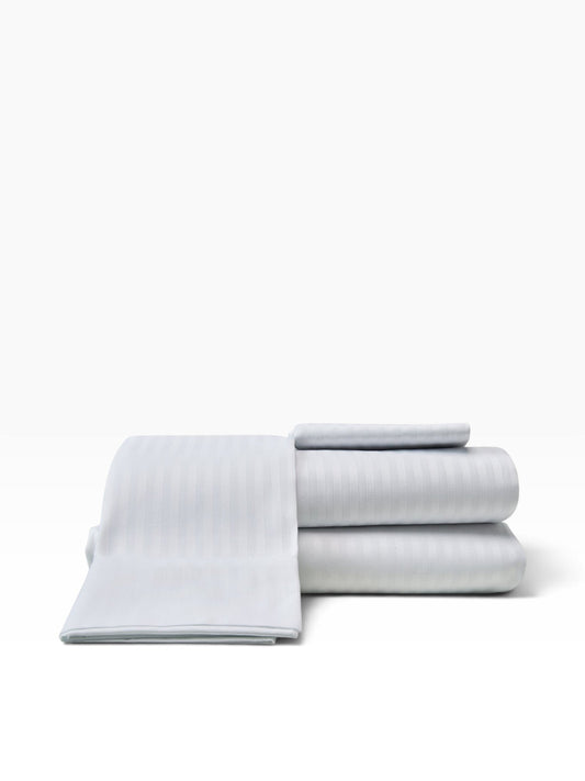 Valiant Products Royal Suite white flat sheets with a subtle tone-on-tone satin stripe pattern and crisp hem finish