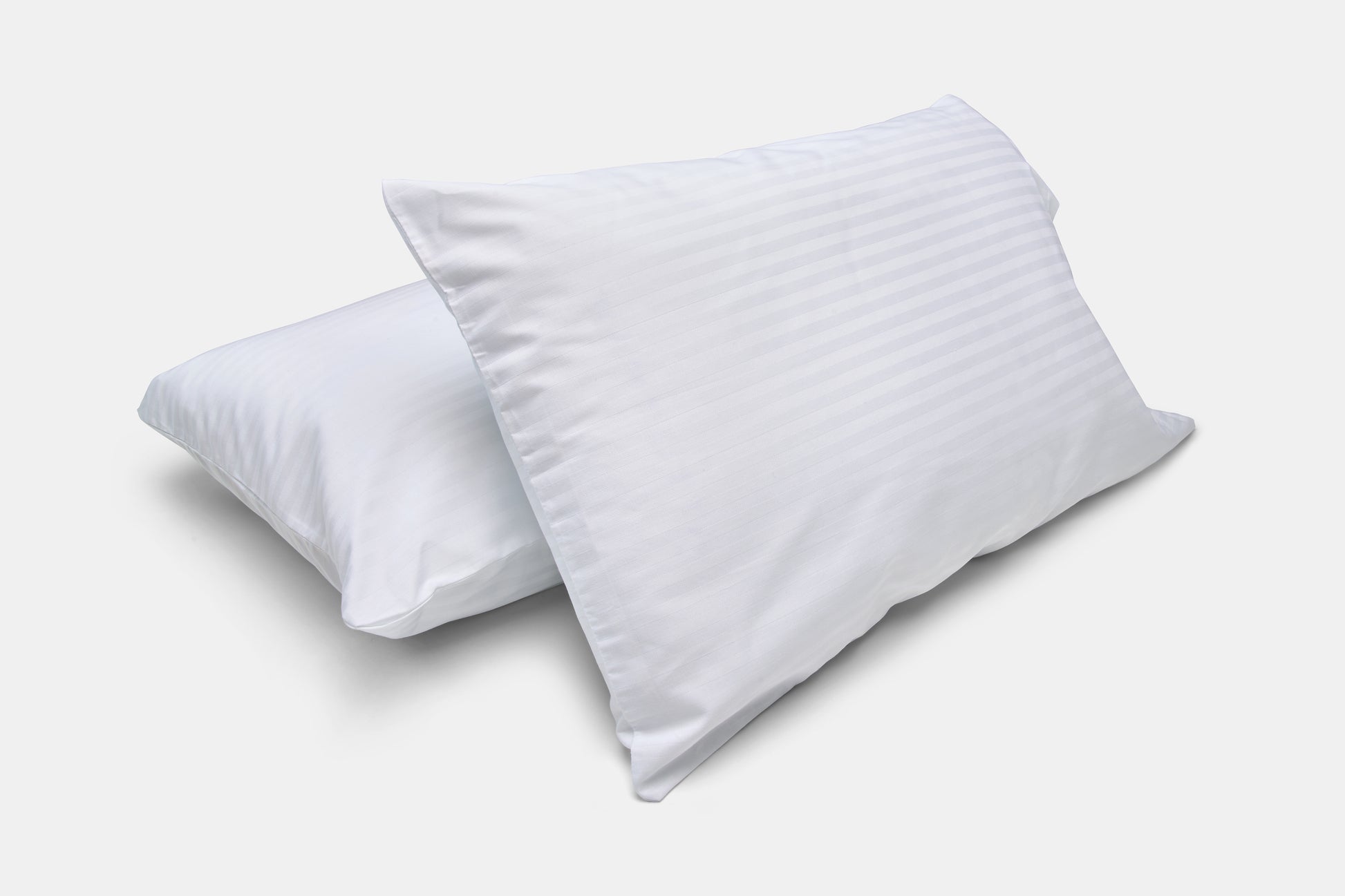 Valiant Products Royal Suite white pillowcases with a subtle tone-on-tone satin stripe pattern and cotton blend fabric