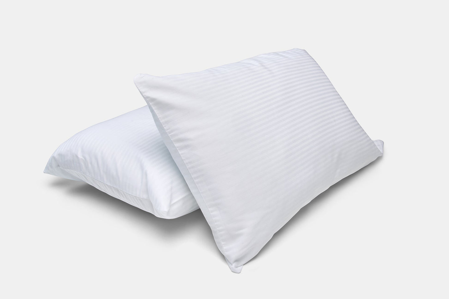 Valiant Products white cotton-blend pillowcases featuring a subtle woven satin stripe and durable T-250 thread count.